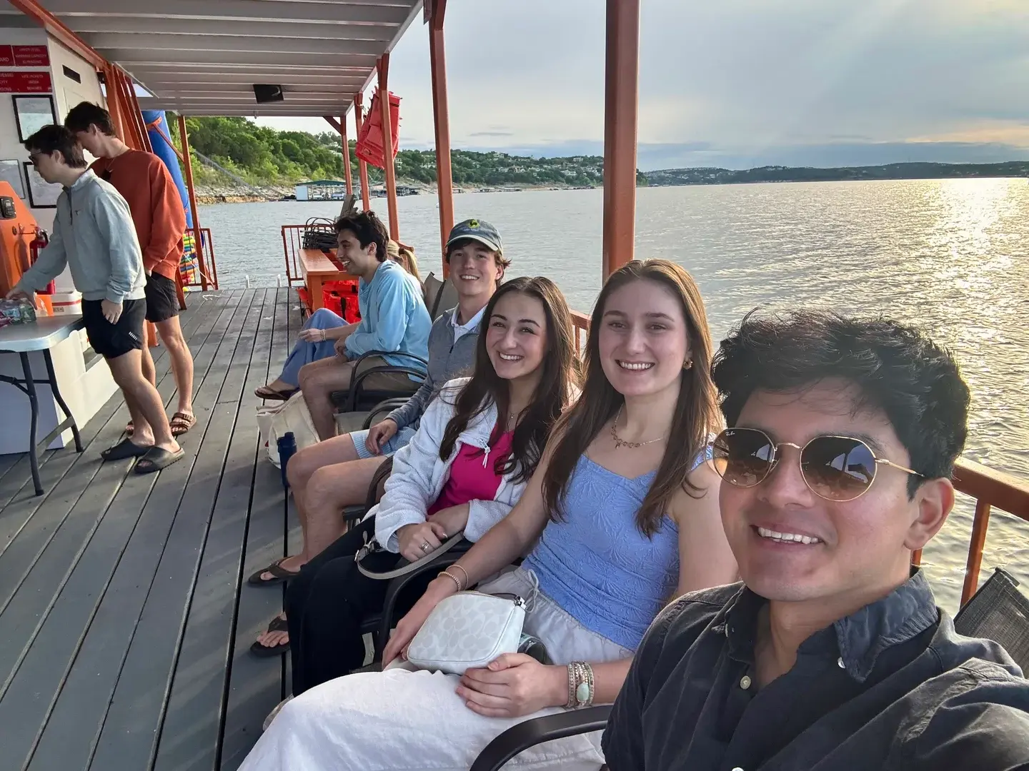 WMSO members seated together at a lake social.