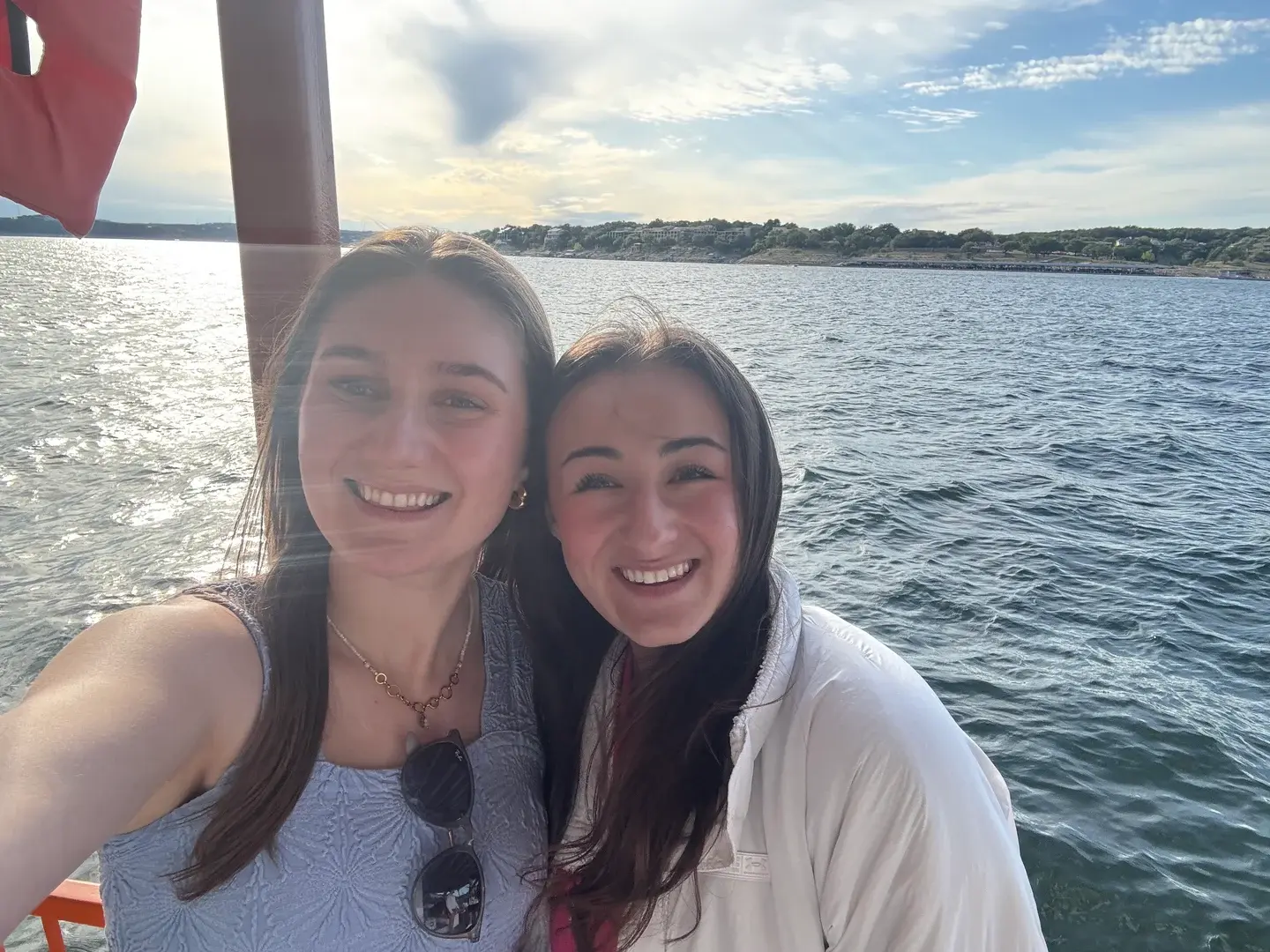 Two WMSO members smiling at a lake social.