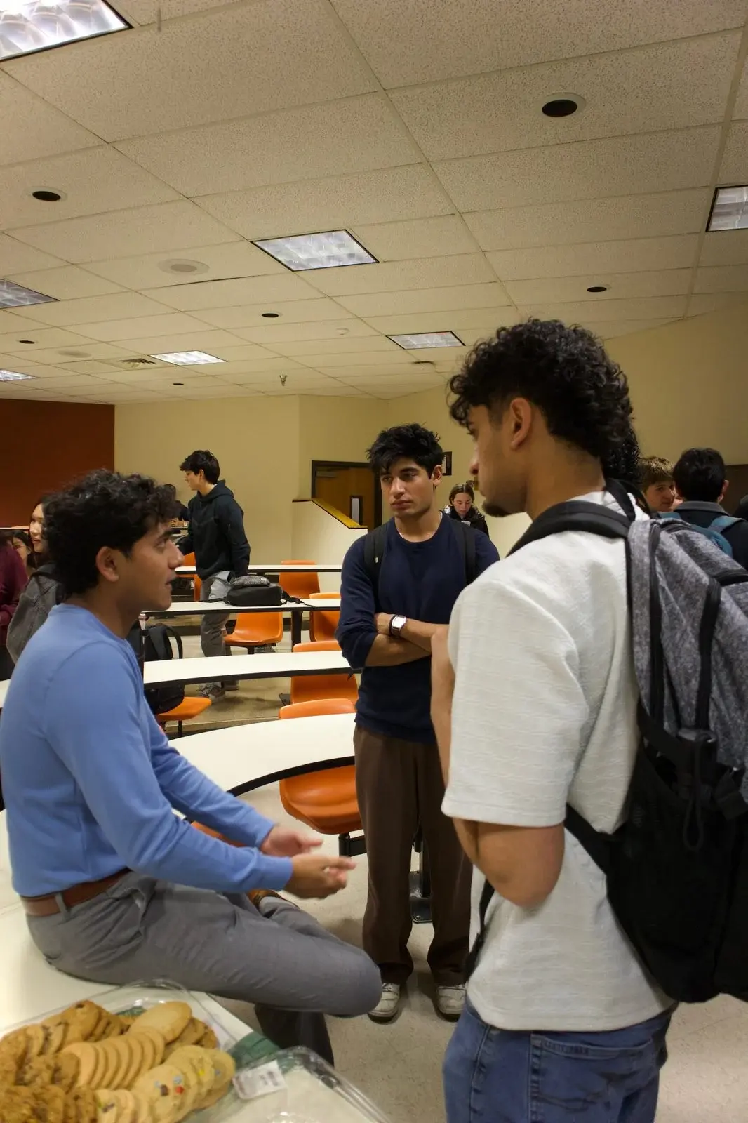 Students talking at a WMSO information session.